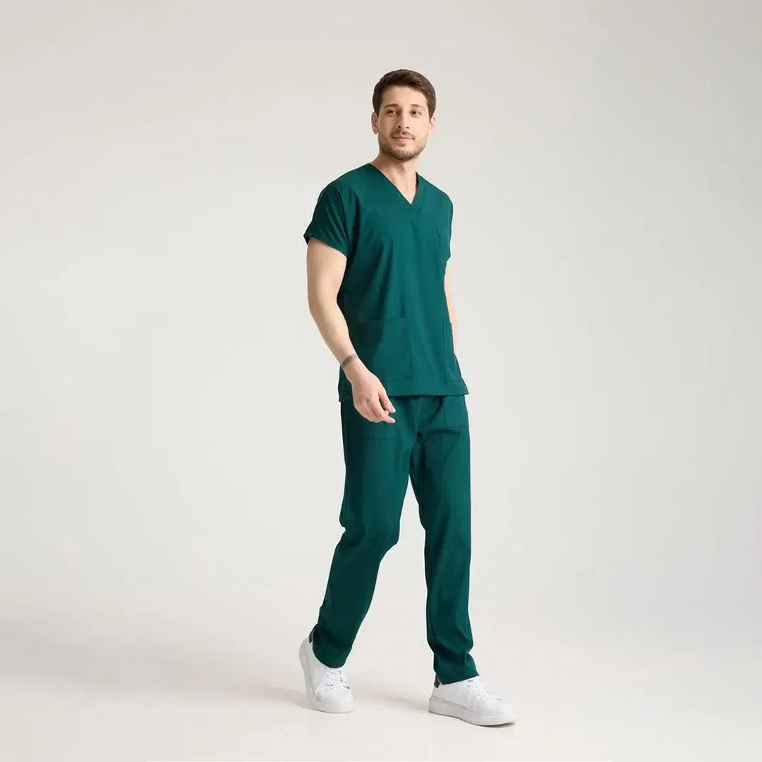 Close-up of a custom jogger scrub pant pocket embroidered with a hospital logo indicating professional medical apparel branding.