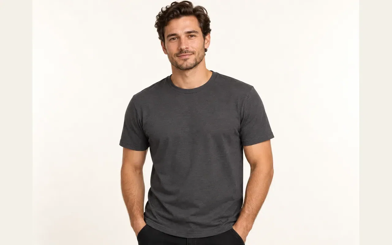 AI-generated illustrative studio image of a model wearing a blank charcoal T-shirt