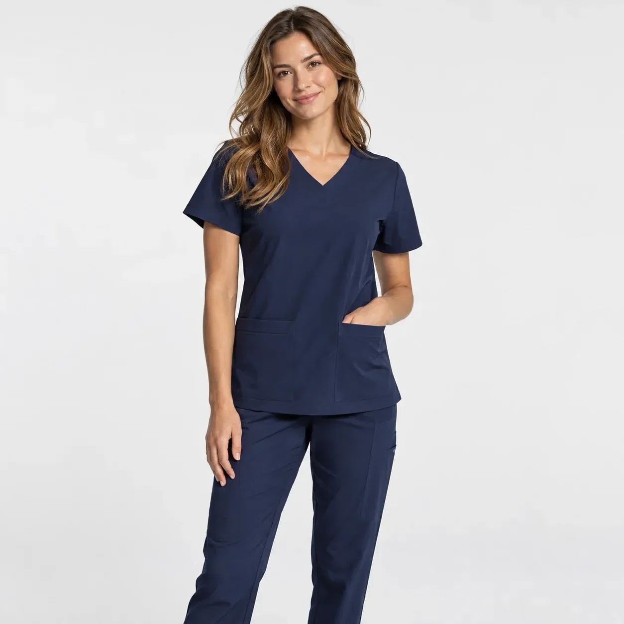 Illustrative studio image of a navy nurse scrub set
